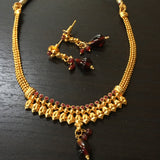 Delicate fit-necklace with red stones and leaf design