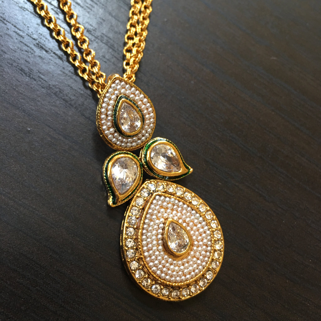 Cream Moti necklace with Cylinder pendant and red stones